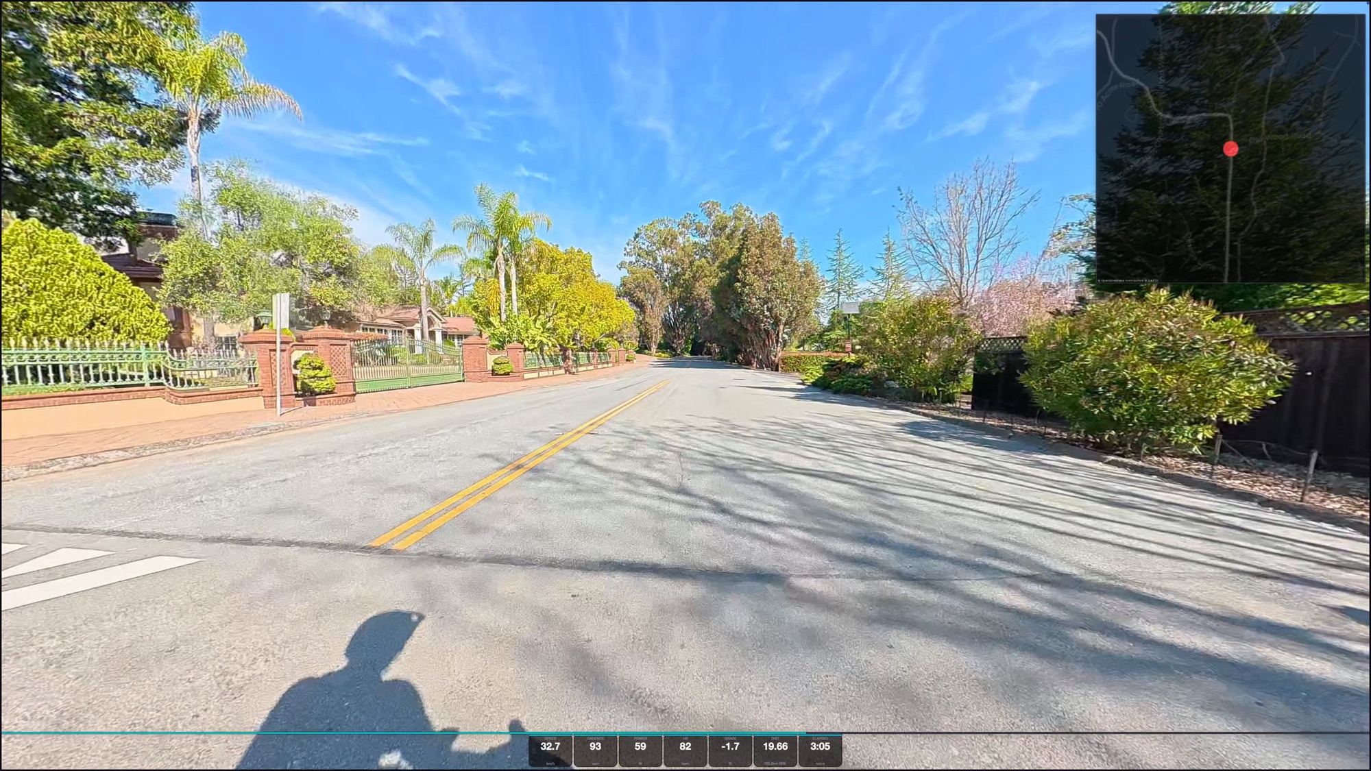 Ride Simulator running a recorded route with live speed, power, grade and heart-rate HUD, plus a route map